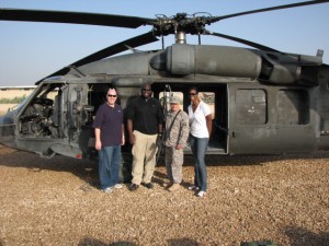 Blackhawk MVP & SFC Scott Angle in front of an Army Blackhawk helicopter